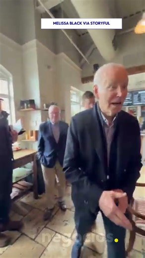 Joe Biden greets customers at a Wilmington coffee shop