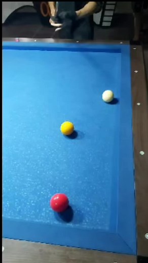 Mastering Pool Techniques on a Blue Table