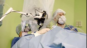 operation of removing a malignant tumour with modern laser technology, one surgeon is performing