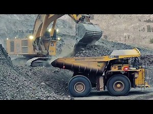 Komatsu PC 5500 Excavator Loading Komatsu 980E & Cat 793F Dump Trucks