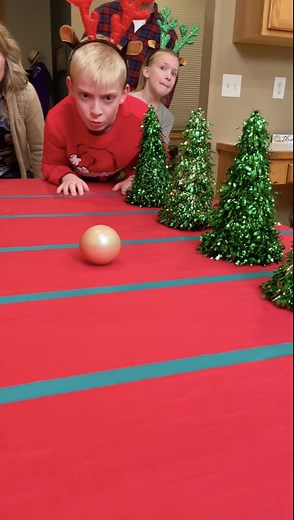 The Christmas Tree Party Game 🎄 Dad, mom, and kids play perfect Christmas party game with trees, ornaments, and fun festive prizes. This video was produced by Paul & Kezzy, Network Media, and Benson Bros. | The Scene Machine