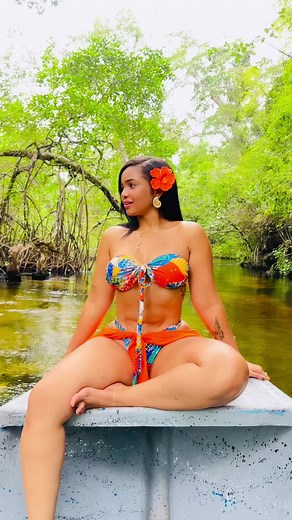 Scenic Boat Ride in Colorful Bikini