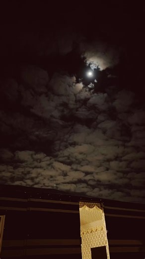 Stunning Full Moon Through Dramatic Cloud Cover