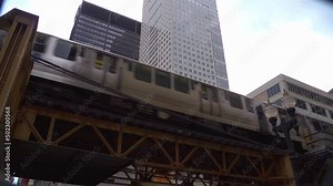 Looking up as two trains pass on the elevated railway, Chicago