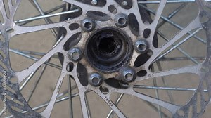 brake disk of a bicycle wheel,repair of a bicycle wheel, a wheel without axles, replacement of axles and a brake disc