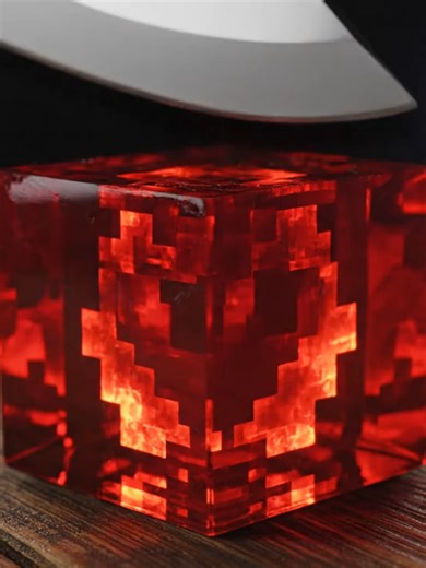 ‏"Sharp knife carves through a dense Minecraft redstone block, sparking...