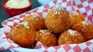 7.8K views · 69 reactions | Leftover rice gets the ultimate makeover with this quick and easy recipe for Italian Arancini! Stuff them with your choice of cheese, veggies or meat, coat them in breadcrumbs then give them a quick dunk in hot oil for a crispy, cheesy snack. No breadcrumbs? Crush up crackers, pretzels or stale bread, and don’t forget the marinara for dipping! RECIPE: https://www.justataste.com/arancini-rice-balls-with-marinara-sauce/ | Just a Taste | Facebook