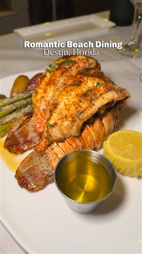 Joanna Davis on Instagram: "Fun fact: I used to work valet at Beach Walk Café back in 2000 when it was at the Crystal Beach Inn… and let’s just say there may or may not have been a little parking mishap on the job 🤫 Fast forward 25 years, and now I’m sitting here enjoying lobster dinners and sunset beachfront vibes. Also they’re the only restaurant I’ve come across to offer a private table direct on the sand for the date of a lifetime with their VIP “Toes in the Sand” experience. #floridalobste