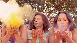 Young women having fun with powder paint