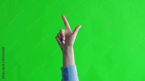 Green screen. Chromakey. Female hand shows two fingers