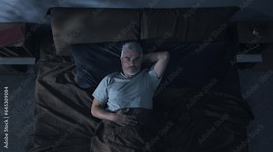 insomnia problem depression,top down view of mature man on bed having trouble sleeping,sleepless overthinking male has difficulties to sleep at night overhead shot Stock Video