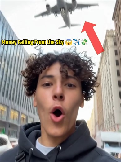 Money Raining from Airplane Over City Road