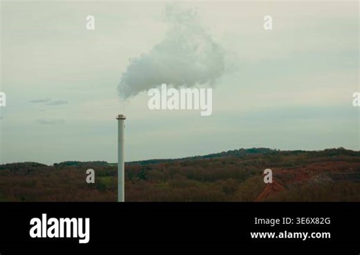 Factory chimney with heavy smoke pouring into polluted sky above industrial zone. Large scale production generating dangerous emissions contaminating air and harming ecology. Climate change intensifying while toxic waste gases drifting over rural Stock Video Footage - Alamy