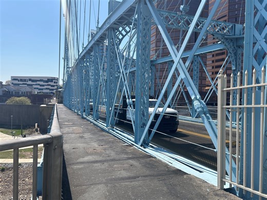 Crews work to remove graffiti from historic Roebling Suspension Bridge