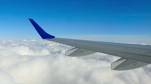 Cloud landscape from an airplane window - Free Stock Video