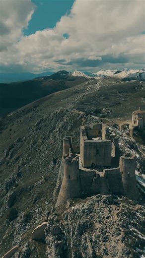 Rocca Calascio, a hauntingly beautiful 10th-century ruin crowning the Gran Sasso mountain in Abruzzo, Italy, is one of Europe's highest fortresses at 1,460 meters. Built by the Acquaviva family to guard the Cammino della Transumanza, it features rugged stone walls and watchtowers offering panoramic views of endless pastures. Destroyed by earthquakes in 1461, its skeletal silhouette starred in films like Ladyhawke and The Name of the Rose. This little-known wonder blends medieval military archite