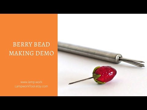 Strawberry lampwork bead making - multi-poking tool in action