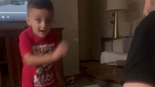 Dad gets a surprise slap from his toddler during playful game