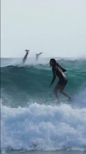 Woman Displays Surfing Skills on Ocean Waves - 1361387