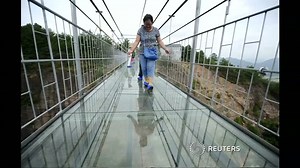 Scary glass bridge opens in China
