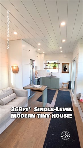 Would you live in this 11.5' x 32' single-level tiny house? One of my favorite floor plans—perfect retirement home or in-law suite? Inside, there is a large L-shaped kitchen with full-size appliances, a spacious living room with a large couch & a mounted TV, a bedroom with a closet (!), & a full bathroom with a beautiful tile shower & a washer/combo unit! Built by Canadian-based Tiny Spaces 🇨🇦 #tinyhouse #tinyhome #housetour #hometour #guesthouse | Dream Big Live Tiny Co.