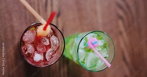 Two fresh mojito cocktails at the table in restaurant, vertical video