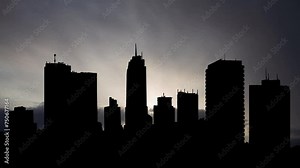 Kinshasa Downtown at Sunrise, Time Lapse with Fast Clouds and Dark Silhouette of Skyscrapers