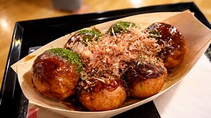 Trying festival food inside a Tokyo onsen experience