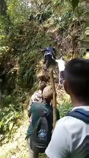 Poll workers in India going on a Trek to reach a remote polling station, India requires a poll booth within 2km of every registered voter.