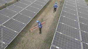 Technician installing solar cell. Installation and maintenance of solar cells at station. Technicians mounting solar panels. Installing alternative energy photovoltaic solar panels Stock Video
