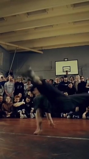 Breakdancing Performance in a Vibrant Indoor Space