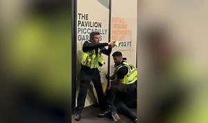 Manchester: Officer draws a taser during an arrest