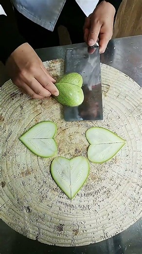 Chopping knife skills, try now! Knife skills display: slicing heart from cucumber.