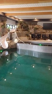 Bringing the outdoors indoors with this residential poolside water feature 😎 See how we built this in our YouTube video: https://youtu.be/bfYNxLSLqSU?si=gdAta_x2pUQL73sg #rockscapesofcanada#fauxrock #fauxrock #pool #epicpool #ontario #fakerock #waterslide #construction #design #interior #artificialrock #canada #artist | Rockscapes