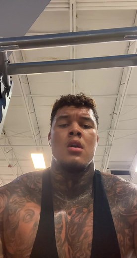 Tattooed Fitness Enthusiast Showcases Gym Workout