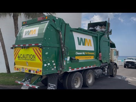 Waste Management CNrG Mack MRU Heil Sierra Front Loader Garbage Truck on Dumpsters at the Beach