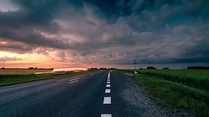 Evening road time lapse. Passing cars visible | Premium Stock Video Footage