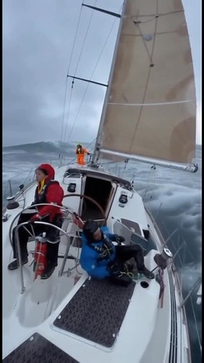 Nature shows no mercy 🌊⛵ A small sailboat battles through towering waves and roaring winds — pure courage against the sea’s fury. ⚡💨 #fblifestyle | Love Sailing