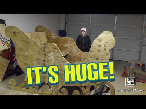 Winfield wooden Giant sleigh and reindeer in our front yard.