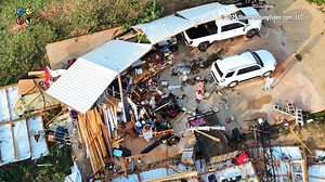 Troy, AL Tornado Aftermath Drone 00:00 Flyover of a home with the roof ripped off and debris scattered everywhere from Tornado in Troy, AL 00:41 (2 Clips) Troy Sportsplex Gymnasium roof ripped off from tornado 00:56 (3 Clips) Troy Sportsplex Baseball fields and Miracle League field damaged from tornado 01:21 (2 Clips) Roof damage on commercial building 01:41 Gas Station destroyed from tornado and roof ripped off building in Troy, AL 01:56 (3 Clips) Wrecker crews working on flipping over semi tip