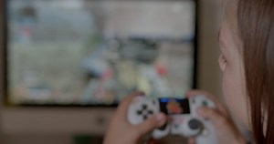 clip-1089945261-child-playing-rpg-games-sitting-computer-operating