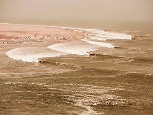 This Drone Footage Of People Surfing Namibia's Skeleton Bay Is Insane [Video]