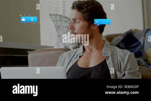 Man shifting focus to laptop as blue social notifications appearing near him tracking engagement. Workfromhome, couch, livingroom, computer, daylight, focused, bubbles Stock Video Footage - Alamy