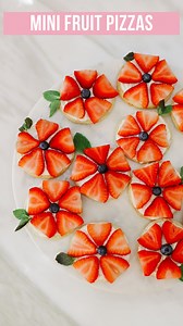 FRUITY & FLORAL MINI SUGAR COOKIE PIZZAS ❤️ These strawberry sugar cookies take me back in time to when I was a little girl! My Grandma Betty and I would spend summers on her lowa farm baking cookies, pies, and endless amounts of desserts. She had such a knack for elevating the simplest of recipes just like this one! If you’re looking for a quick, simple, and delicious recipe to take to 4th of July and summer bbqs try this one that is taste tested and approved by my Grandma Betty herself! INGRED