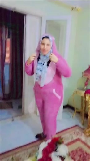 Enjoying a Cozy Day in a Pink Fleece Onesie