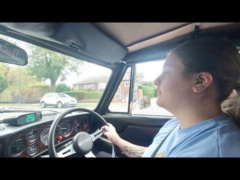 Young and inexperienced driving a classic car Triumph Stag V8