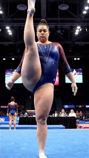 Gymnast Raises Her Leg in Powerful Front Stretch
