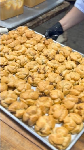 After our coco puff shells are baked and cooled down, they're immediatyle hand stuffed with chocolate filling and piped with our chantilly frosting 💛 | Liliha Bakery