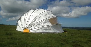Mollusc dome tent flips open to function as a scenic sunshade