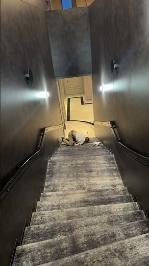 Man Tumbles Down Long Carpeted Stairs